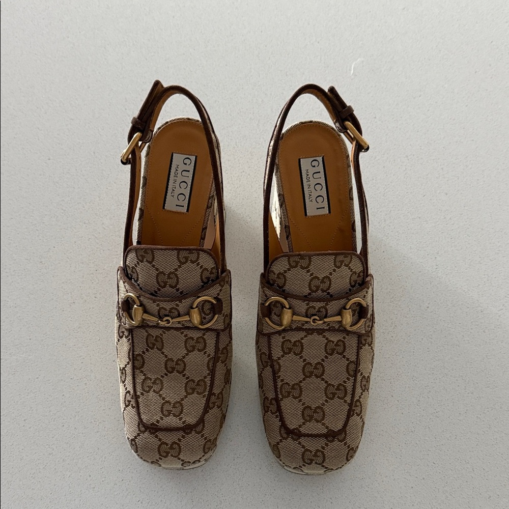 Gucci Women's Brown Monogram platform sling backs.